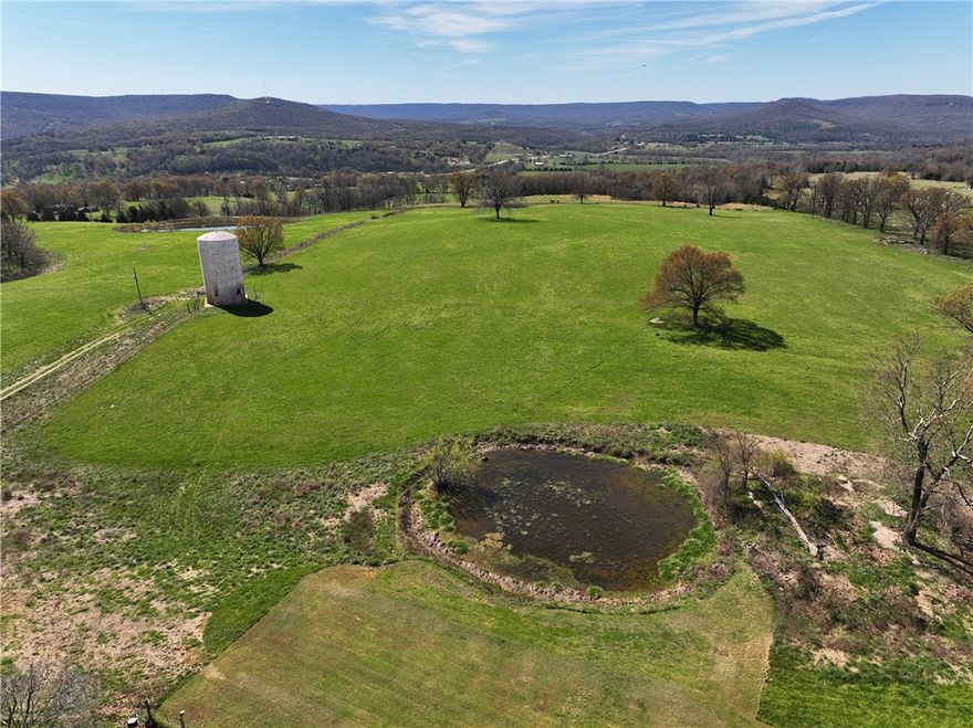 This beautiful parcel of land 37.5 +- acres (subject to new survey) offers a rare combination of functionality and breathtaking scenery. It features three ponds, perfect for livestock or simply enjoying the natural setting, and is fully fenced, making it ideal for grazing or agricultural use. The rolling terrain provides a spectacular view of the surrounding Ozark landscape, creating a peaceful and picturesque environment. Whether you’re looking to build, farm, or simply escape to the country, this property is a must-see.