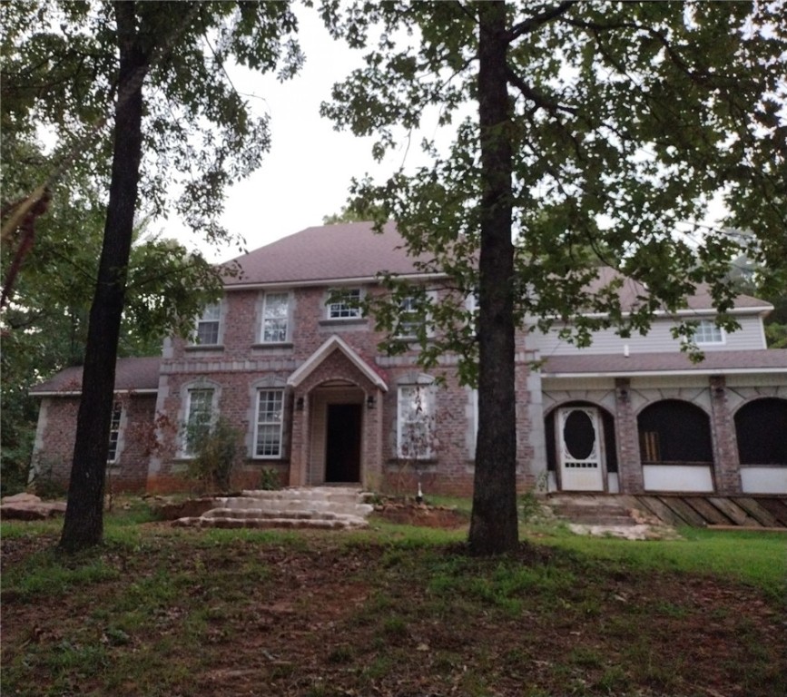 Welcome all buyers! A rare find awaits you at 13722 AR-215, Mulberry, AR. This stunning property built in 2008 offers 3 bathrooms and 1 half bathroom, two spiral stair cases, brand new hard wood floors, office, mother in law suite, and 5 bedrooms all together. That's a generous 3,607 sq.ft. spread across two story situated on a vast 1.8-acre lot, this home is priced well below market value. Act quickly, as opportunities like this don't last long Seller is very motivated. Seize the chance to secure a profitable deal and make it yours today!