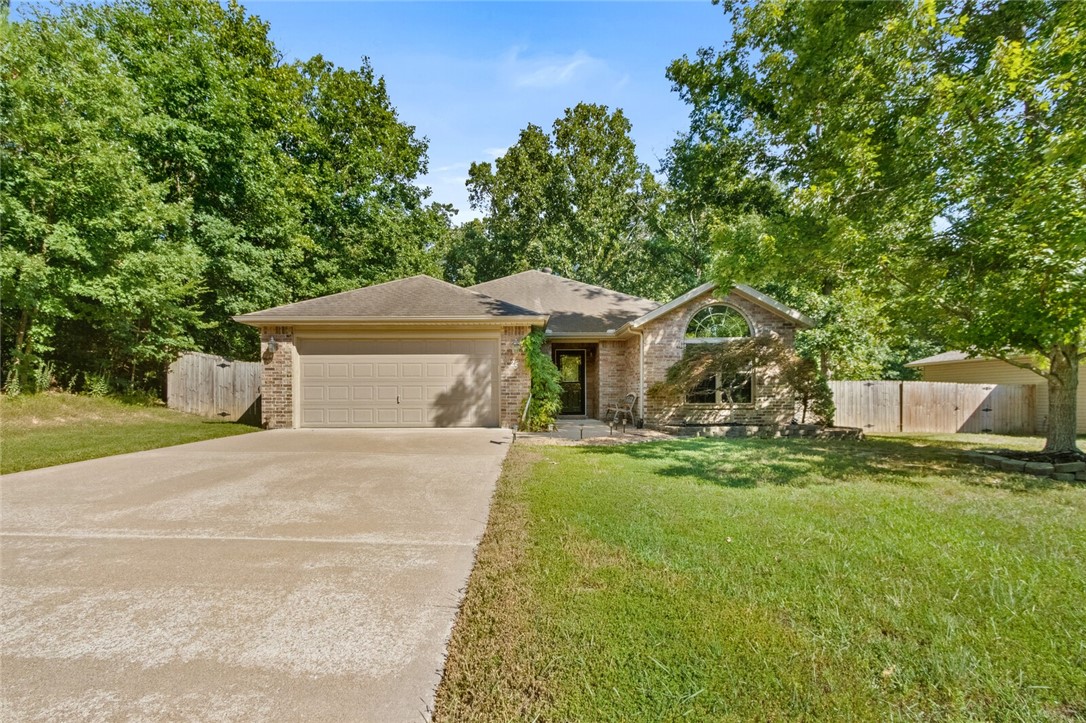 Home Sweet Home!! Luxury vinyl plank and tile throughout the house. Very well kept home with a sunroom overlooking an oasis like fenced in backyard, perfect for entertaining. Covered back patio area with beautiful landscaping. Large living room with a gas fireplace. Kitchen has tons of counter and cabinet space with a breakfast bar and eat in kitchen. Large master bedroom with tall ceiling. Master bathroom has a walk-in shower, jetted tub, & a walk in closet.