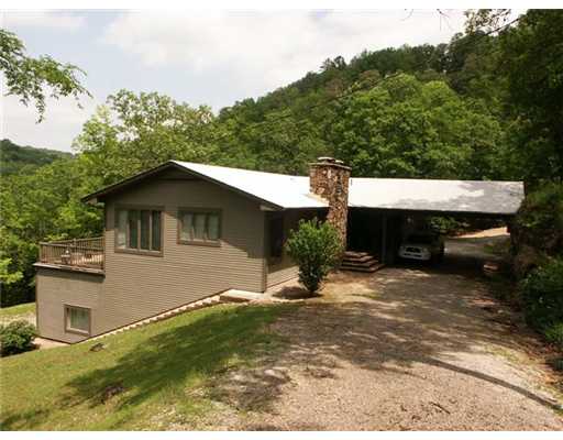 Lakefront home with huge living room and community dock slip located right below the house! Home is well maintained and has an open yet cozy feel. 2 bedrooms upstairs, each with their own bathroom. Basement is over 2100 square feet including one garage,stall. Most of basement is a large concrete room. Would be a fantastic shop or could be converted to more living area! House sits on 1 acre lot with view of the lake. Access on paved roads and concrete boat ramp in the subdivision. Furniture is negotiable
