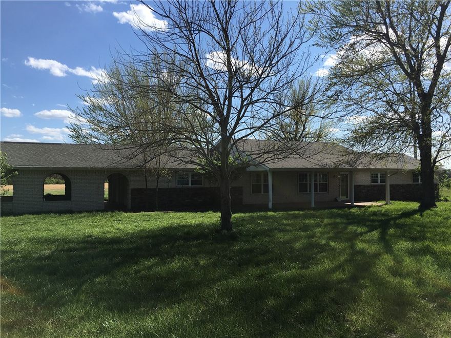Updated and remodeled 3 bedroom 2 bath home, wood floors, new carpet, new appliances, new paint, new fixtures, new EVERYTHING.  Very spacious, wood burning fireplace off kitchen, breakfast bar, front porch, extremely large back porch, 2 car garage with another 2 car carport.  Home sits on 6.5 acres.  A must see!!
