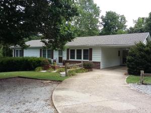 Must see! Gorgeous home has so much to offer you will love coming home to three beautifully landscaped lots full of shade trees. New windows and roof in 2014. Beautiful hardwood in bedrooms, a finished basement boast's a huge family room, bedroom and workshop area.