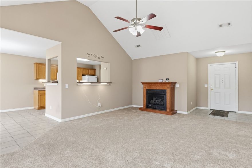 Brand new roof installed April 2026. Home sits on a big corner lot featuring a life saving 8-person tornado shelter in the garage, protecting your family in a storm. Great location as directly across from Gentry High School. Brand new carpet in living room, hallway and bedrooms. Spacious living room has vaulted ceiling, stand alone gas fireplace, large window beaming natural light throughout. Living room opens to kitchen, so you can cook and still be engaged with family. Kitchen features plenty of counter space, lots of cabinets with under lights, pantry and dining area. Primary bedroom features a trey ceiling and has a walk-in-closet and a full ensuite. Two more generous bedrooms on the front of the home allow plenty of space for the kids, guests or an office. Garage has gas wall heater and floored attic with rotor and antenna. Out back there is a big 10x20 concrete patio, 220 plug for hot tub, multiple sheds and workshop with electricity and a space for parking trailer or boat. Furnace and AC only 3 years old.