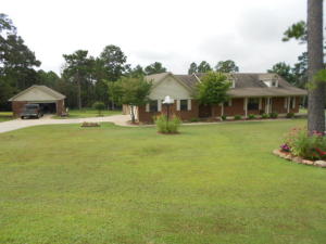 SWEETEST HOUSE IN TOWN. Cozy living room with gas log fireplace for added warmth, formal dining room, Craftsman custom cabinets in kitchen, granite counter tops, all new stainless steel appliances and open stairway to attic storage. Re-bath has redone master bath. large covered porch in front. Deck in back, black chain link fenced rear yard.