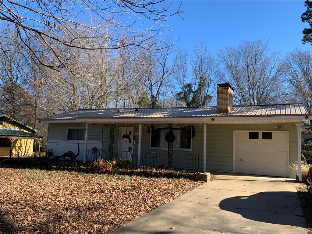 Adorable 3 bedroom, 1 bath ranch style home in excellent location! Minutes from I-49, U of A Campus, and close to shopping. Updated throughout, kitchen with modern look, and updated flooring. Huge fenced in backyard for dog to play or for relaxing. Fireplace inoperable.