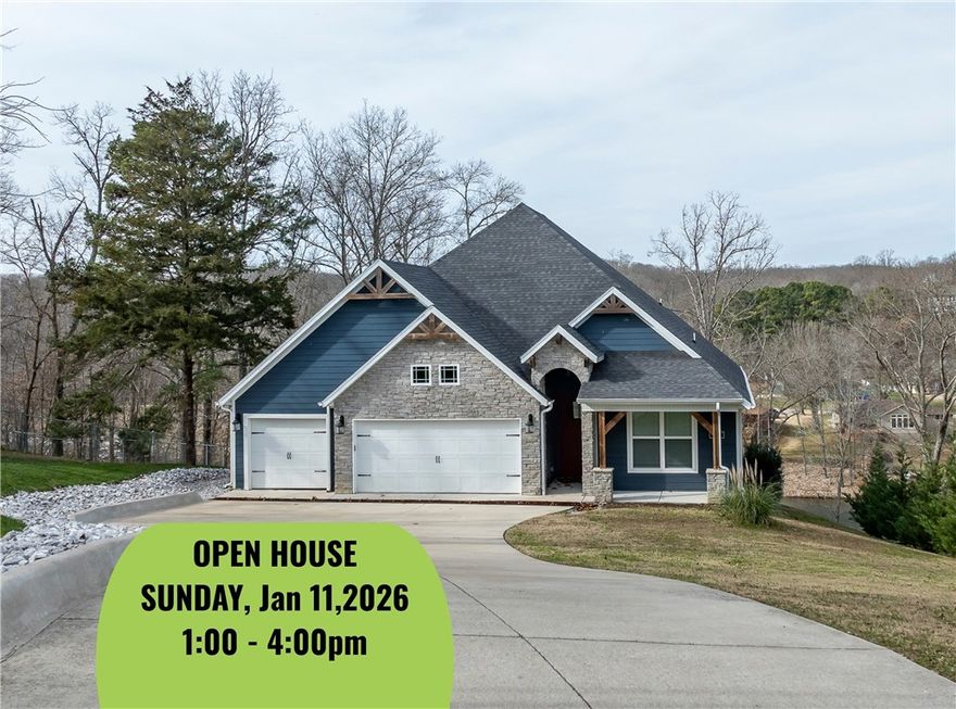 Is there a 3-bed home on Lake Windsor with soaring ceilings, lake views, and two full living spaces? This 3694 SF custom-built lake-style retreat offers all that and more. Set on 0.62 acres with 80 feet of lake frontage, it features vaulted wood-beamed ceilings, panoramic windows, and an open-concept great room designed for lakeview living. The main level includes a luxurious primary suite with custom shower, lake views, and walk-in closet with direct laundry access, plus a second bedroom with its own full bath. The walk-out lower level adds a second kitchen, massive living area, full bath, third bedroom, and a bonus room ready for your home gym, studio, or office. Built in 2019, the home includes all-electric systems, tile floors throughout, and a spacious 3-car garage. Enjoy Bella Vista amenities, lakeside recreation, and a quick commute into Bentonville — all from your private lakefront escape.