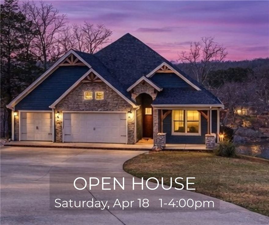 Now offered at $997,000—this Lake Windsor waterfront home with panoramic views and flexible multi-level living is newly positioned to align with today’s buyers. Set on a 0.62-acre lot with ~80 ft of lake frontage, this 3BR, 3BA home offers 3,694 sqft across two levels. The main level features vaulted wood-beamed ceilings, expansive lake-facing windows, and an open-concept great room ideal for entertaining. The primary suite offers lake views, a custom tiled walk-in shower, and a walk-in closet with direct laundry access. A second bedroom and full bath are also on the main level. The walk-out lower level includes a second living area, full kitchen, third bedroom, full bath, and flexible bonus space. Covered outdoor living plus additional lower-level storage for lake gear. Built in 2019 with tile flooring throughout and a 3-car garage. Enjoy lake living with easy access to Bentonville.