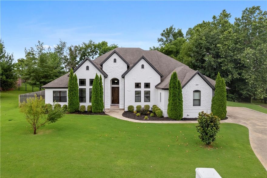 Custom-built stunning estate nestled in a quiet cul-de-sac in Thornbury, one of the area’s most prestigious neighborhoods. Thoughtfully designed for everyday comfort and elevated entertaining—whether you're hosting a pool party, game night, or movie night in the media room. Private backyard features a heated pool, covered patio with fireplace and outdoor TV, offering seamless indoor-outdoor living. Inside, soaring ceilings and hardwood floors create a warm, inviting feel. The kitchen includes a large island, gas cooktop, double ovens, and a built-in coffee and wine bar with wine storage—ideal for early mornings or evening wind-downs. The main level offers an oversized primary suite with spa-like bath and direct access to the outdoor oasis, plus three additional bedrooms and office space. Upstairs, enjoy a media room with wet bar and a spacious, versatile bonus room with full bath—endless possibilities. Minutes from I-49 and steps from the Greenway, this home perfectly blends luxury, lifestyle, and location.