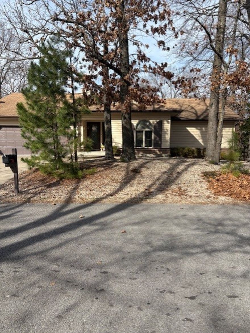 Fantastic Bella Vista corner lot home with an open split floor plan. This home features a large living room with vaulted ceilings, wood accents, and skylights. The living room has a pellet stove fireplace. The walk out basement features a living room as well as unfinished storage area or workshop. Enjoy the back yard with privacy fence and newly stained deck with pergola. Maintenance free exterior. Many updates completed in 2019 including, HVAC, roof, flooring, fixtures, carpet, toilets, deck and neutral paint throughout. Enjoy all that Bella Vista has to offer.