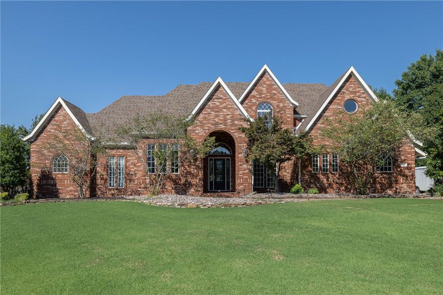 Stunning 5-bed, 4-bath home boasting a pool, nestled on 1.39 acres in esteemed Thornbury Subdivision. Fresh upgrades include NEW carpets & paint throughout. Elegant Two-Story Formal Living Room features a fireplace flanked by shelving, while a second fireplace graces the Den with thoughtfully integrated built-ins. Chef's Kitchen is equipped with dual ovens, gas burner, & a central island for all your culinary creations. Owner's Suite, complemented by a sitting room, includes a private bath with walk-in shower & jetted tub. Additional highlights encompass a Bonus Room & playroom for versatile activities, & a richly adorned wood-trimmed office. Open floor plan with two bedrooms conveniently located on the main level, with one bath providing access to the pool area & sprawling fenced backyard, enhancing the indoor-outdoor experience. Situated on a cul-de-sac in a fantastic Springdale location with easy access to I-49. Embrace the prospect of gracious living & effortless entertaining in this truly exceptional home!