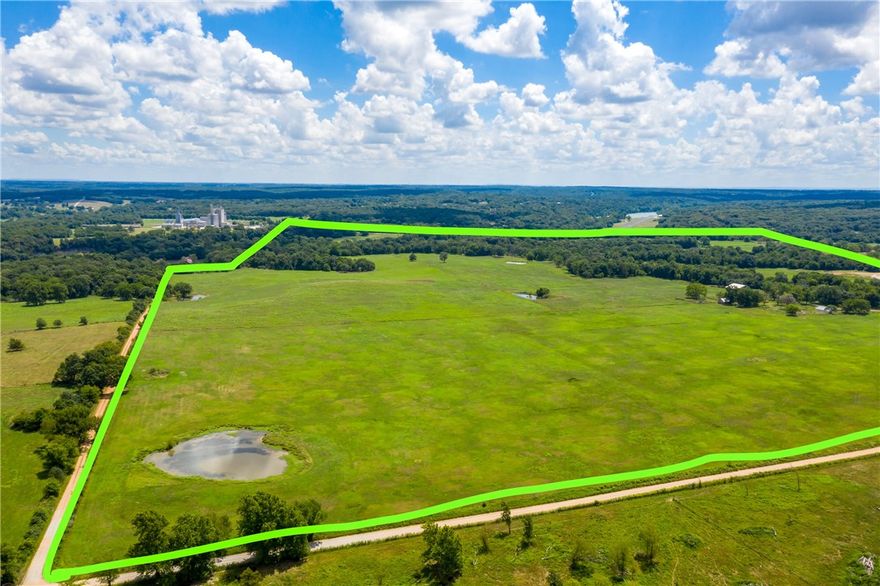 Over 330 Acres directly across the street from Elementary School on one side and Veterans city park on another. Perfect for future development. All utilities at the street. Property currently used as working cattle farm with two year-round live springs, multiple ponds. Fenced and cross-fenced. Several barns. Great for farming or future development as the area continues to grow. Seven parcels total, see photos or attachments for details.