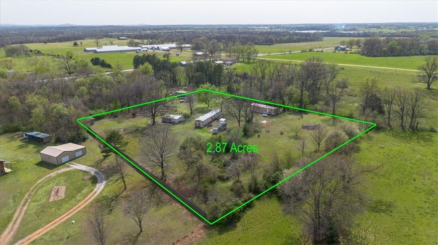 Prime 2.83-Acre Property in Siloam Springs, AR. This property sits just a few mins from the HWY 59 and 412 HWY intersection, close to down can be to the hassle and bustle of the major cities very quickly.  This private, level lot offers multiple ideal building sites and is equipped with multiple meters, making it a fantastic investment opportunity. Whether you're looking to develop, build your dream home, or secure a promising piece of land, this property has endless potential!  There are two mobile homes that can stay with the property or be sold and removed.  Come see this great opportunity today.