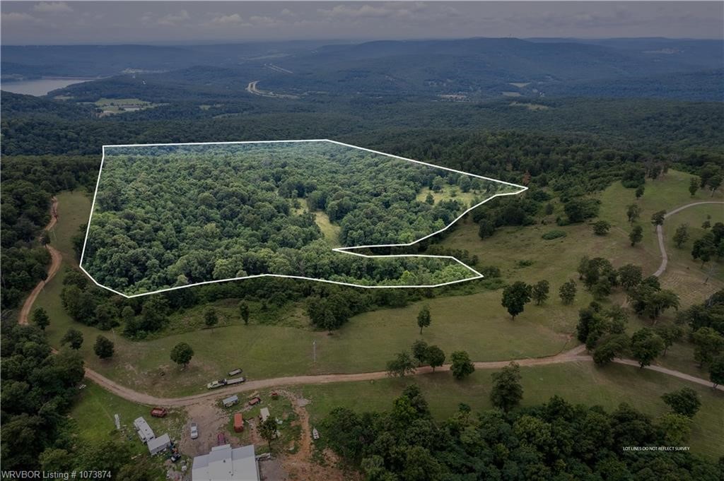 Gorgeous mountain top views in Boston Mountains! Mainly woods, 6-7 acres cleared, with building site. Water & electric available at street. Wildlife abounds with deer, turkey, black bear & small game.