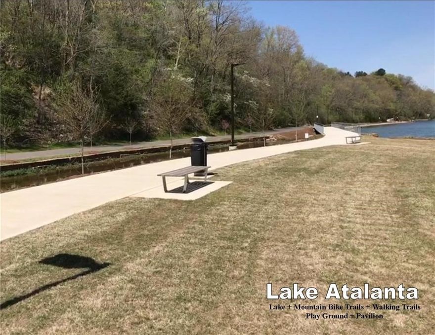 Tucked beside the natural beauty of Lake Atalanta, this rare 4-acre wooded parcel offers a private retreat just blocks from the energy of downtown Rogers. Towering oak trees, flowering dogwoods, and redbuds create a canopy of mature landscape, while a wet-weather creek winds through the lower portion of the property, adding natural character.. Mountain bike trails run along the east side of the property, offering direct access to Northwest Arkansas’s most loved parks. Spend mornings on the trail or walking the park, then enjoy coffee shops, dining, and events in the downtown hub just minutes away. This property is ideally suited for a private estate home, eco-retreat, wellness center, or thoughtfully designed nature-forward residence. The setting feels worlds away, yet the location keeps you connected to everything Rogers has to offer. A truly unique opportunity to build something special where nature, privacy, and walkable downtown living intersect. Buyer to verify utilities. Additional acreage available.