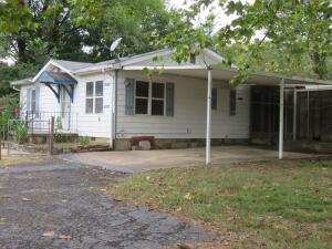 Cute 2 bedroom, 1 bath home on large lot with nice workshop featuring concrete floor and roll up door. Newer roof, Central Heat and Air, and more updates. Would make great investment home or call your own.