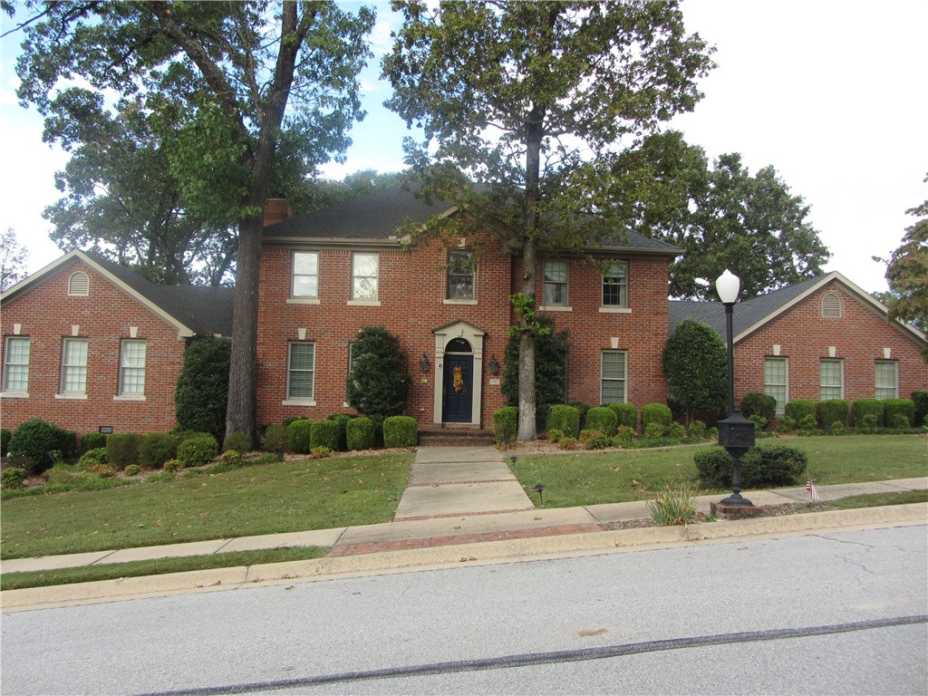 LOCATION, LOCATION, LOCATION. Prestigious Hanover S/D, Georgian home sprawls .50 acre corner lot w/side-load garage. Grand entry w/ hardwood flooring throughout living areas. Large rooms, 2 LA. 2nd LA adjoins kitchen & feels like walls of windows overlooking private backyard w/water feature & decks. Formal dining, kitchen features large island w/lots of work space. 5th bedroom could be office. S/D connects to Razorback Greenway, downtown Bentonville, & Crystal Bridges. Two minutes to I-49.