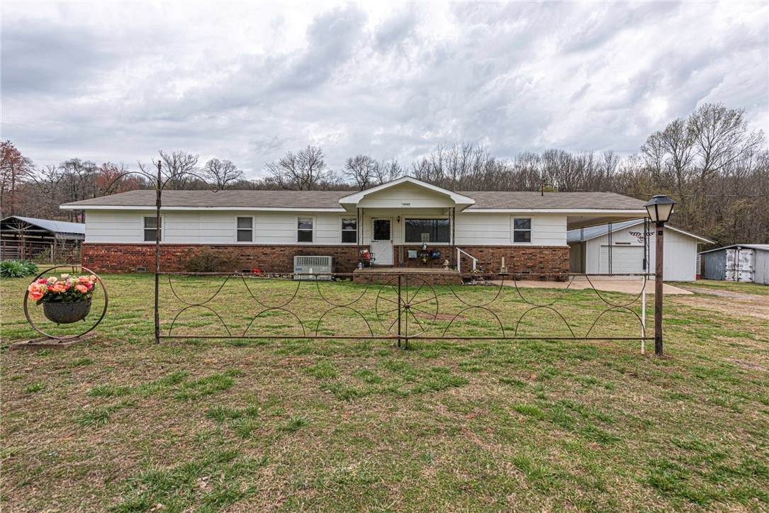 **SOLD BEFORE PRINT*** WELCOME HOME! This 3 bedroom 2 bathroom home on 14.92 Acres +/- is just what you have been waiting for. Home features covered front porch and inside a spacious living room with semi open concept into dining space and U-shaped kitchen featuring counter height peninsula! Combined pantry/laundry/storage room! Plus large bonus room and convered back patio! Property also features several outbuildings including a 1 car garage with shop space (approx 1,144 Sqft), partial metal fencing perfect for horses, metal storage building (8x16), pole shed (24x40), wet weather creek, pond and more! This partially open & partially wooded property is perfect for anyone looking to start their hobby farm or explore and hunt!