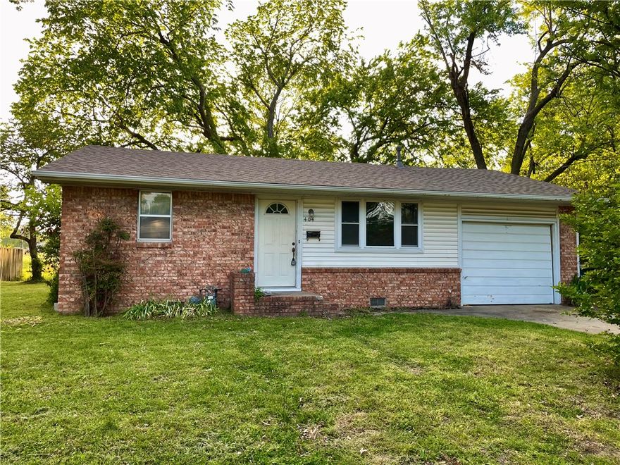 Charming and conveniently located, this 2-bedroom, 1-bath home sits on a no-through street in the heart of Springdale. Inside, you’ll find a cozy living room with a decorative pass-through to the kitchen, wood-stained cabinetry, gas range with hood, stainless dishwasher, and a built-in hallway cabinet with drawers for extra storage. The home also features a full bath with a tub/shower combo, a one-car garage, and a welcoming front stoop. Enjoy the back patio and open yard—perfect for relaxing or entertaining. Just around the corner from the aquatic center, Murphy Park, the library, restaurants, and shopping, and only minutes to Downtown Springdale and nearby trails—this location offers both convenience and lifestyle! Whether you're looking for a new home or looking for an investment opportunity, this property offers great potential. Don’t miss your chance to own a home with easy access to everything Springdale has to offer.
