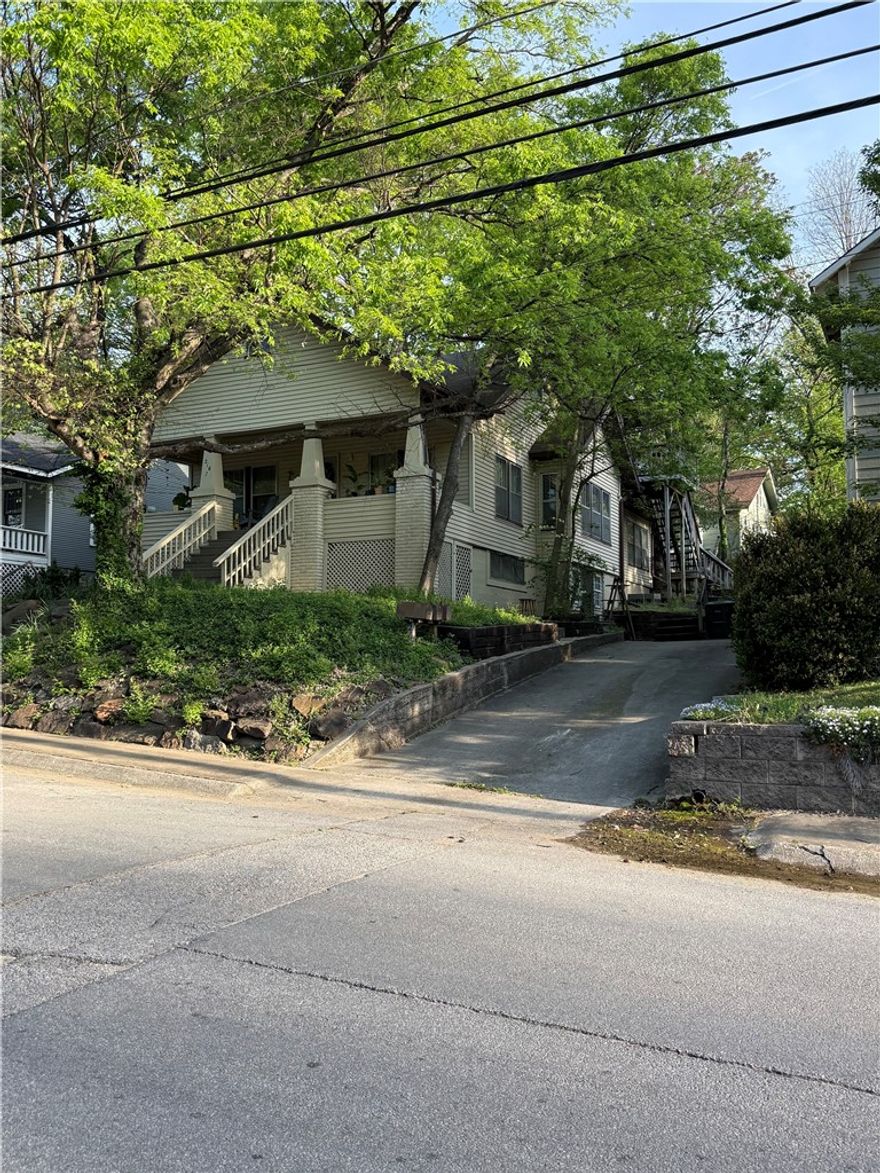 Fully leased and located just a block South of N College and three blocks from both Dickson Street and the Fayetteville Square this three unit apartment home is a tried and true downtown income producing property. Three unique units with large rooms, off street parking, and walkable to all things Fayetteville. All units are tenant occupied. Do not disturb tenants. All units will be made available to view once a pre-approved contract is in place.