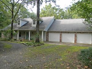 Don't miss this beautiful custom 5 bedroom 4.5 bath homes on 4+ private acres located only minutes from town in the Russellville Center Valley school district. This spacious home features a large living room with double french doors and a wood burning fireplace capable of heating all downstairs rooms, 5 bedrooms plus an office/hobby room (or could be 6th bedroom), formal dining room and breakfast area, large kitchen with island, and a huge bonus room perfect for the ultimate den or game room. The large multi-level deck is great for entertaining guest, grilling out, or simply napping in your hammock while enjoying the private natural setting. Also features a 3 car garage with work area. New hickory flooring downstairs. Complete with sprinkler system, central vacuum system & security alarm
