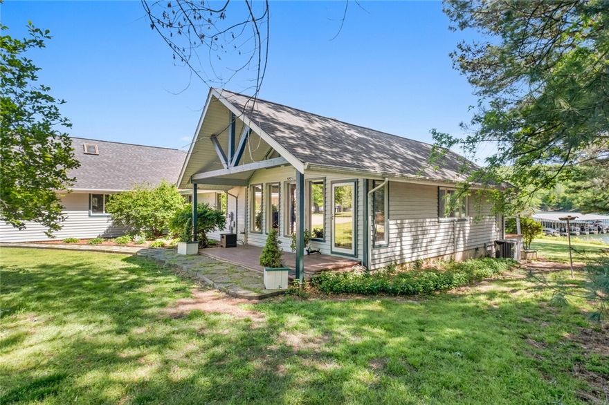 This is truly a once-in-a-lifetime, custom-built, Beaver Lake home with a beach, boat slip in a small shared dock, and views of the bluff slide across the smooth water in this glassy cove. Each home in the small community neighborhood is uniquely beautiful and it’s remotely located for the perfect amount of privacy.  The yard is flat, and sodded, with mature trees and gentle slopes in the back, a diamond, on the typically rocky and steep shores of beaver lake. Home is 50 feet from the water with 150 feet of shoreline with direct access to the water and dock.  You can have it all in this timeless home with tons of storage above the living areas and a bonus room above the garage. Warm wood and finishes plus vast natural lighting from impressive windows that allow for incredible year-round lake views keep this home feeling like the perfect mix of vacation and home.  Final and best offers by Friday 26th at 7 pm