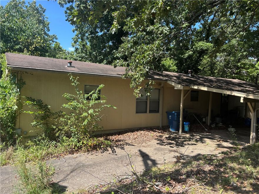 If you are looking for a rare opportunity in NWA, an affordable investment with lot of upside potential, look no further.  Whether you are looking for a rehab project that could actually be worth the effort, or a perfectly situated lot to start over with a new home, this is the spot for you.  This mobile home is being sold as-is, but could be a great fixer! This property IS situated in the Bella Vista POA so you'll have access to amenities and it's just around the corner from biker trails, restaurants and more!
