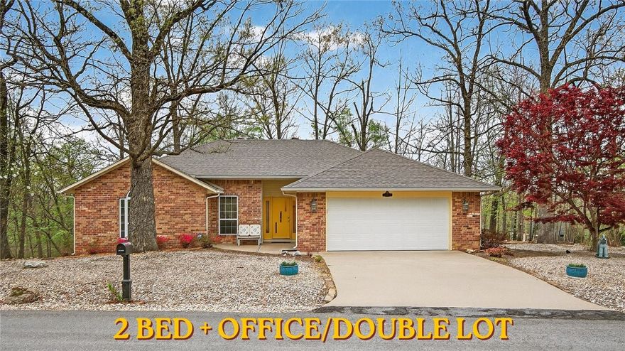 Welcome to Renfrew Lane! Your new home with a FLAT double lot. Room to build a shop, extra parking, or a spot to enjoy the peaceful scenery of Bella Vista. This home is close by Loch Lomond, Lakepoint Restaurant & Event Center, and The Bella Vista Bypass. Easy access to Bentonville and beyond. Inside you'll find an open floor plan with your wood burning fireplace and an office off of the living area. Your primary bedroom leads into the spacious sunroom that overlooks your lot of over half an acre. The home has been well maintained with a new roof in 2021, an HVAC thats regularly serviced, a septic tank thats recently been inspected/pumped, and a new water heater in 2023. Nothing beats a home thats been well cared for. Come check out 1 Renfrew Lane!