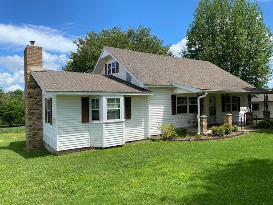 Cozy four bedroom, two bathroom farmhouse with unlimited possibilities that boasts 9' ceilings on the first floor, large family room for entertaining family gatherings. Two car detached garage with small workshop. Pleasantly situated on a large .64 acre corner lot with old growth trees and lots of charm. Easily accessible cellar under the home. Great proximity to NWA... only minutes away from Elm Springs, I-49, HWY 612,412 & 112. Less than 15 minutes away from XNA, Promenade in Pinnacle Hills and North Fayetteville.