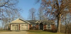 Pure serenity! Just a short distance from city amenities, but you will feel like you are miles away from it all when you own this little piece of heaven. Main floor is open concept,Master BR,Master BA, 1/2 bath, and 2 BR with Jack-n-Jil BA, split bedroom floor plan, wood floors, large kitchen w/pantry & partially covered deck with Hot Tub .Basement has additional Jack-n-Jill BA,1 BR and 1 Room with window but no closet. Large living area, safe room, John Deere Room, covered patio and Storage, Storage, Storage!! Large fenced in back yard.