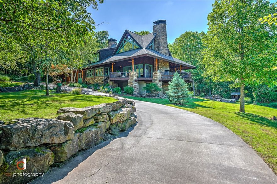 Welcome to the HGTV featured Brooks Mountain Retreat! With over 4 acres and views for miles, this one-of-a-kind & thoughtfully designed home is where dreams come true. Designed by Cal Canfield, influenced by Frank Lloyd Wright & E. Fay Jones, this home includes: Site harvested cedar posts throughout, exposed scissor trusses, 3 native stone fireplaces, cherry floors & cabinets, antique doors from England, custom designed Weather Shield windows, cedar lined master closet, laundry shoot, 6 burner Viking range, Hoshizaki ice maker & Sub Zero fridge, outdoor entertaining spaces, outdoor fire pit & fireplace, and SO MUCH STORAGE- all weather carpet in basement & over-sized garage both include work spaces. With beautiful winter views & 8,000+ tulip bulbs as a spring surprise, this sanctuary is a must see! Security System, Ring Doorbell, & whole house surge protection are added bonuses. Don't miss the bedroom loft that leads to the best puppet shows in the upstairs family room!
