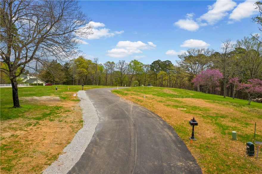 Build your dream home in this charming newer subdivision less than 2 miles from historic downtown Eureka Springs!  It's conveniently less than an hour to Rogers' vibrant shopping and entertainment districts as well. You can secure this +/- .34 acres with annual taxes estimated currently at $389 for your new construction now. With underground utilities accessible at street, well-maintained curb areas and a gently sloping wooded view, this idyllic lot would make a great place to call home.