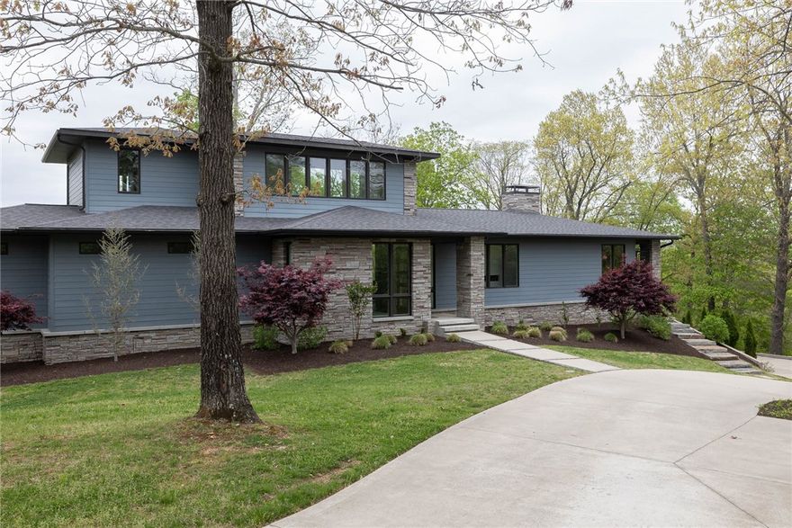 Absolutely stunning lake front home w/ a 4 stall private boat dock located 10 minutes from downtown Rogers! 4,764 heated sq ft includes 4 bedrooms, 5 full and 1 half bath, open eat in kitchen to living, mud room, laundry, and bonus room.  Amenities include a chef’s kitchen w/ gas range, built in refrigerator, warming drawer, ice maker, walk in pantry, his and her primary bathroom and closets, hardwood floors, built in bunk beds, incredible walk in storage, and a 3 car side load garage.  Don’t miss the 617’ of private shoreline and a groomed gravel walk to your private boat dock and swim deck.  Both boat lifts convey as well as the automatic spider boat cover.  Truly a one of a kind!!!