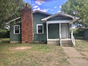Mini farm located on 5 acres! Live here and fix this home up just the way you like it. Detached two car garage ( needs doors ). There is a nice big barn for your farm animal's. Updates include A/C replaced in 2020, Hot Water Tank replaced in 2016, Septic cleaned in 2021. Home has asbestos siding. Property sold as is.