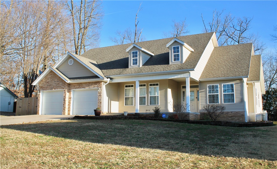 PRIME EAST BELLA VISTA LOCATION and FLAT LOT with fenced backyard! Cathedral ceilings, eat-in kitchen, pantry, formal dining, and laundry room make this a MUST SEE! New flooring on first floor was added in 2021. HVAC replaced in 2018 with 3 programmable, zoned thermostats. Gas log fireplace in the living room is ready for the cold winter nights. Owner's bedroom is oversized, with a walk-in shower and walk-in closet in the owner's bathroom. Upstairs find a large bonus room that is ideal for movies, games, a guest bedroom, or home office. This home is already on Sewer, Village Wastewater (sewer) fee is $25/mo. Long, level driveway is simple to navigate. Shed in the backyard is great for added storage. Bella Vista biking and paved trail systems are accessible from the street, walk out the front door and go!