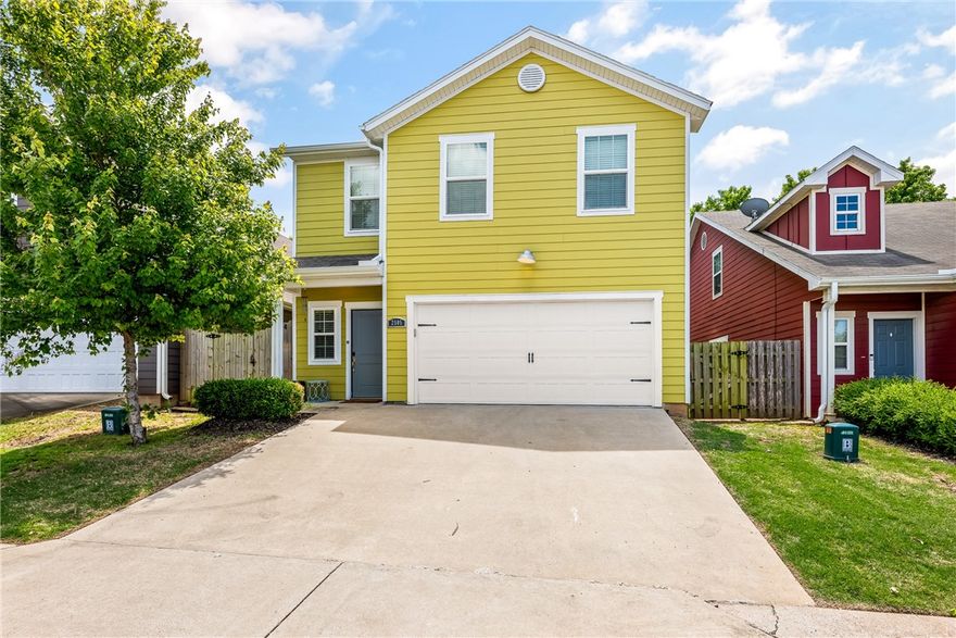 Discover this beautifully crafted two-level home in a prime location. The main level features a spacious primary suite with en-suite bath, a half bath, and open-concept living/ kitchen with hardwood floors, granite countertops, tiled backsplash, stainless steel appliances, and white cabinetry. Upstairs, you'll find two additional bedrooms, a full bath, and the flexibility of laundry hookups on both levels. Private side patio enclosed with a privacy fenced in yard—perfect for relaxing, entertaining, or enjoying a peaceful evening outdoors. POA covers lawn care, making maintenance a breeze. Located near growing businesses, restaurants, Bentonville schools, parks, and the community center. This area blends comfort, style, and convenience. Gutters installed 2025!