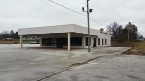 This property has been a Chevrolet Dealership for years; main show room & office have been completely remodeled; new metal service building built approx. 10 yrs ago; sits on approx. 9 acres; service equipment still in buildings; limitless possibilities; Prime property with 600 ft. of 4 lane frontage. Buyer to verify zoning.