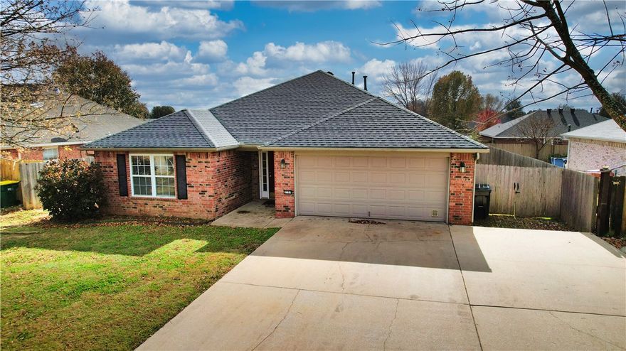 Step into this move-in-ready, all-brick 3-bed, 2-bath home in a quiet, established Springdale neighborhood—perfect for buyers who want style, efficiency, & low-maintenance living. Fully paid solar panels help lower monthly bills! Inside, the 1,655 sq ft split-floor plan delivers easy flow, with an arched entry opening to a bright living room with 10’ vaulted ceilings. The primary suite adds personality with a tray ceiling & accent wall. Enjoy newer appliances, a gas fireplace, a 2-car garage, plus extra parking. The fenced backyard with wooden privacy & a partially covered patio is perfect for pets, play, or relaxed evenings outside. Love the outdoors? Dean’s Trail links you to the Razorback Greenway & Lake Springdale Trail for scenic rides & weekend walks. Close to Jones Center, Walmart Market, parks, schools, & major roads—this home checks all the boxes.