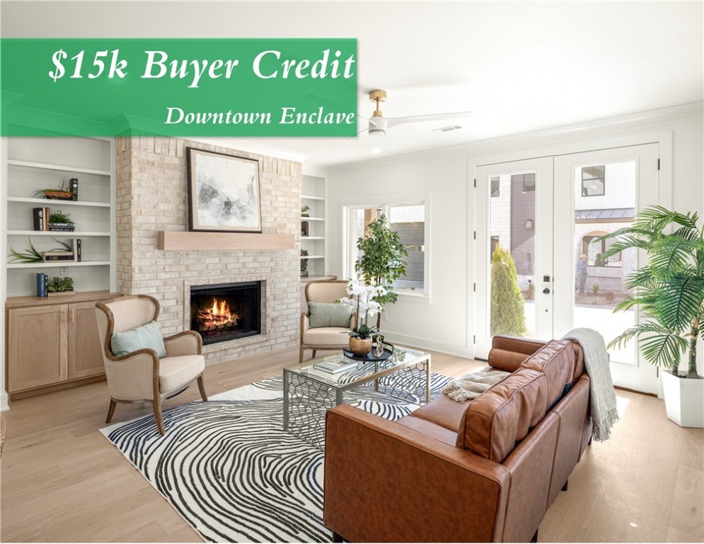 **SUMMER SPECIAL, BUYER RECEIVES A $15K CREDIT TO HELP BUY DOWN INTEREST RATE OR APPLY TO CLOSING COST** Welcome to The Enclave at Bella Vista Road—a beautiful collection of four custom homes on a private drive in north downtown Bentonville. This residence blends refined style with modern comfort, featuring a soft color palette, brushed gold accents, designer lighting, and matte-finished white oak floors. The living area centers around a cozy fireplace flanked by custom glass-paneled cabinetry. The main-level primary suite offers a paneled feature wall and a spa-inspired bath with onyx pendant lights, marble-veined tile, dual shower heads (including rain head), and seamless glass. Upstairs includes a large family room, two bedrooms with a Jack & Jill bath, a secondary suite, and a flexible fifth bedroom or office. Outdoor living is elevated with a covered front porch, open patio, grilling terrace, and a fully fenced, landscaped yard. Discover timeless luxury just moments from the best of Bentonville.