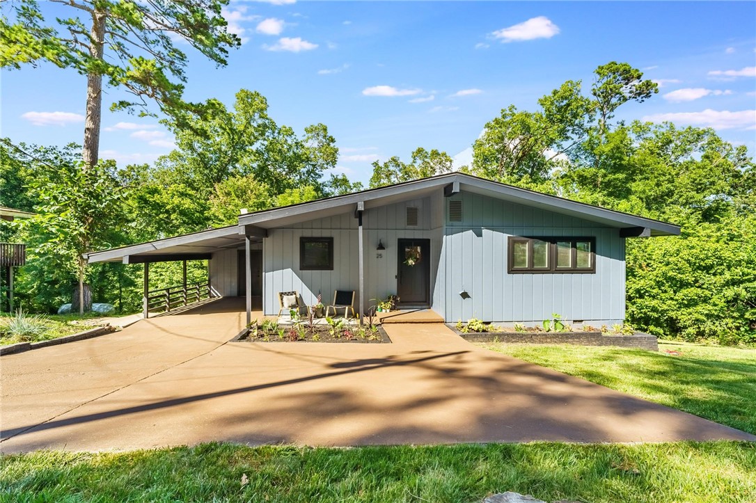 A rare blend of flexibility, function, and opportunity in the heart of Bella Vista! This versatile property features fresh paint and updates throughout, along with a main level that looks out onto a peaceful, tree filled setting. The finished walkout basement adds a second living area with polished concrete floors, a wood burning fireplace, and private access. It’s ideal for guests, extended stays, or creative use. Two attached storage rooms offer impressive bonus space, including one with workshop potential off the carport. The driveway has been extended and stained, french drains were recently added, and the front landscaping has been refreshed. Previously used as a 4 bedroom, this adaptable layout fits a variety of needs. Located in Bentonville Schools with easy access to the interstate, trails, lakes, stores, golf, and Bella Vista’s sought after POA amenities. The layout, location, and flexibility you've been waiting for-don't miss your chance! A $2,500 buyer credit is being provided by the seller!