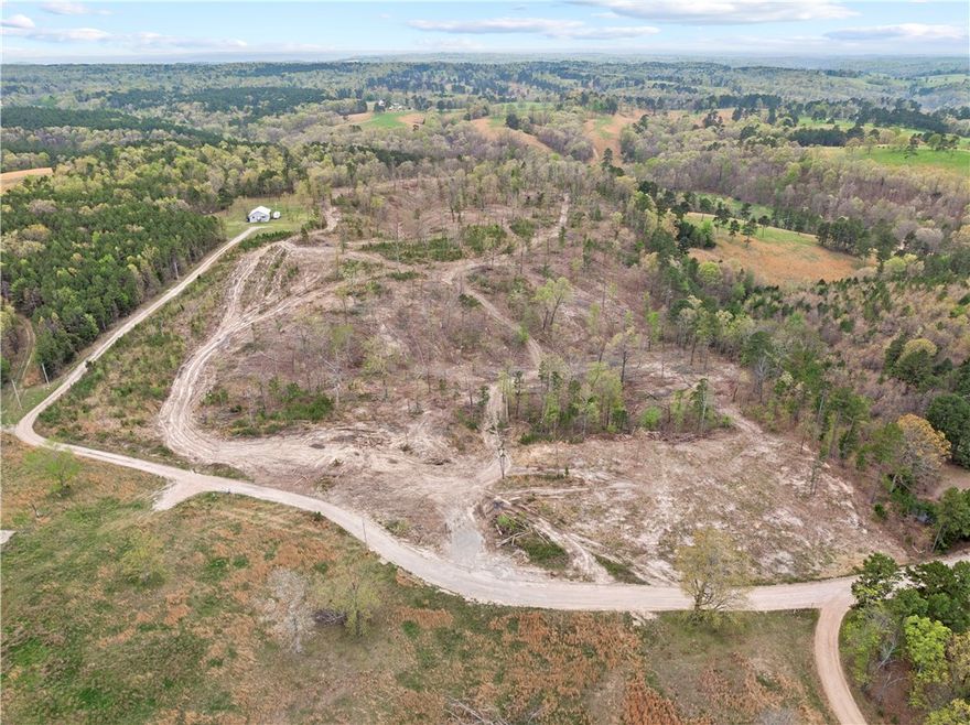 This 26.88-acre (m/l) tract offers the best of both worlds—peaceful seclusion and easy access to outdoor adventure. Located just a 10-minute drive from Bull Shoals Lake, this property is perfect for anyone looking to build their dream home or set up a private getaway. Partially cleared, no restrictions, and already surveyed, the possibilities are wide open. This property is a rare find for those looking for freedom, space, and proximity to the lake. Come check it out!