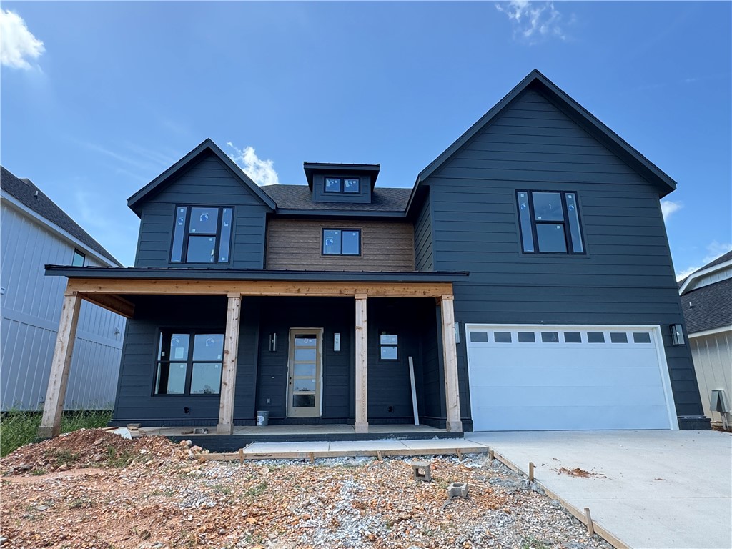 Welcome to Meadow Brook in SW Rogers! Great community in the best location! This plan features 3-4 bedrooms (2 flex spaces either bedroom 2 or study option as well as upstairs bedroom 4 or bonus room). All bedrooms have walk-in closets with plenty of storage! Downstairs you will find the primary bedroom. Great layout with open kitchen/living room area. Kitchen has large island to sit up to 6 bar stools, built-in gas cook top, built-in oven and microwave, large pantry, and eat in dining area. Primary bedroom feature en suite bathroom with soaking tub, walk-in shower, his and hers separate vanities, and large closet with lots of built-ins. Bedrooms 2, 3 & 4/bonus room are upstairs along with2 full bathrooms. Enjoy the evenings grilling on the covered back patio! Can't beat location being only minutes to shopping, dining, groceries stores, and only steps to the Razorback Greenway Trail.
