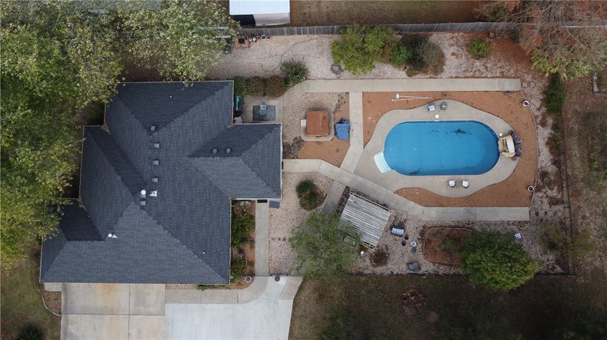 A truly unicorn property is on the market. Sitting on 1.52 acres with a 3200 sq foot shop with attached room/full bath for anything your heart desires in your dream shop. Storing cars? Work on cars? Build things? Party spot? You call it! The house is 3 bed 2 full bath home with a 2 car attached garage and in fantastic condition with finished den/office space, granite counters, inviting family room/open kitchen, and custom tiled shower in the primary bathroom.  This one comes with a fantastic SALT water pool/entertainer space to enjoy the summers in. The vinyl liner was replaced about 3 years ago. All located just 3.5 miles to the McDonald's on Hudson Rd in Rogers and 5 miles to DTR/Onyx. Boundary lines are approximate.