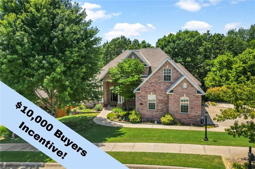 $10,000 Buyer Incentive!! Exceptional home in the prestigious Windemere Woods neighborhood. This residence embodies luxury & comfort, boasting every upgrade imaginable. NEW trail in front of the neighborhood leading to Coler Mountain Bike Preserve and the greenway. Inviting living room showcases Australian Cypress wood floors, corner gas fireplace & extensive crown molding, with an open floorplan. Gourmet kitchen complete with pantry, stainless steel appliances & stunning granite countertops. Formal dining & office with a built-in desk offer spaces of refined utility. Large primary suite and spa-like bath, boasting a walk-in marble slab shower, jetted tub, dual sinks, extra storage & walk-in closet. Laundry room with cubbies, storage & even a laundry chute! Upper level bonus room & attic access. Two secondary bedrooms on each level. Crawl space workshop perfect for storage or projects. Walk out basement includes state of the art theater room. Enjoy wooded views from your screened-in porch, double deck & patio area.