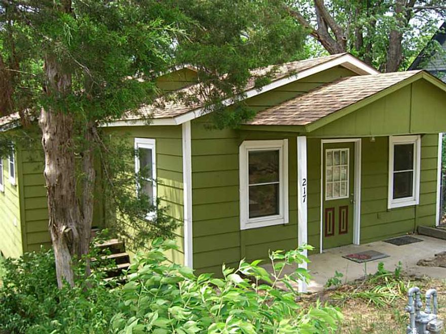 Cute little cottage just a short walk to Fayetteville Square, Fayetteville, Library, Walker Park and trail system. New roof (2014), new vinyl windows (2010), laminate floors throughout (tile in bath). Washer and dryer convey.,Inviting two-level deck complete with built-in benches and Snorkel wood-fired hot tub! Back yard is fenced and covered parking is behind the house. Great home for the price!