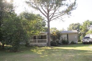Country Setting. 5.36 acres with 3 bedrooms 2 bath home, functional floor plan with spacious rooms, large kitchen with island, wood burning fireplace (never used), walk-in closet in all bedrooms, covered rear 12' x 24' deck, 10' x 20' front porch, 16'6 x 16' workshop with loft, 8' x 8' storage building, and double carport with 10' x 18' storage.