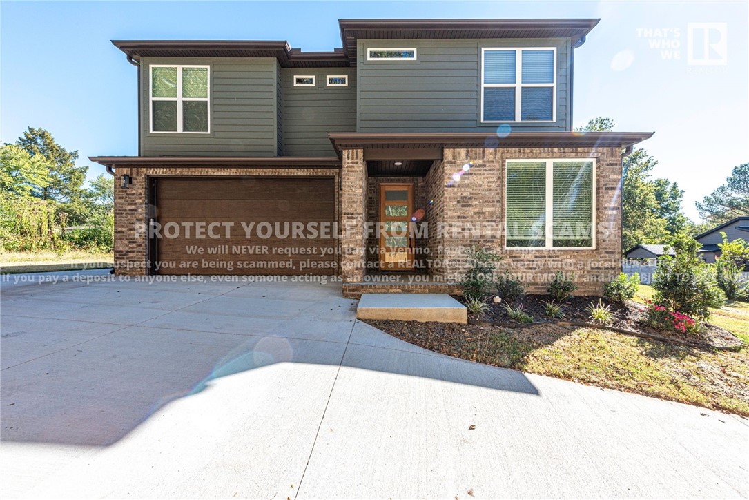 AVAILABLE NOW! Check out this new construction 3 bedroom 2 1/2 bathroom home located a short distance from the University of Arkansas, Baum-Walker Stadium, & just minutes away from shopping, eateries, & parks! Head inside from the partially covered front porch and turn into the office space with a beautifully designed accent wall! Head over to the open concept living room & kitchen with luxury vinyl plank flooring, gas log fireplace, built in shelving & cabinetry, island with breakfast bar, quartz countertops, pantry, and double sink! Make your way upstairs into the primary bedroom with stained wood beams on ceiling & private on suite with tile flooring, a gorgeous bathtub, walk in shower with tile backsplash, dual sink vanity, and walk in closet! Don't miss the spacious laundry room with a sink, closet rod, and extra cabinetry! Relax and relish on the covered back patio with LED disk lights & ceiling fan! PLUS an outdoor fire pit! No cats. **Tenant is responsible for all utilities and lawn care/maintenance