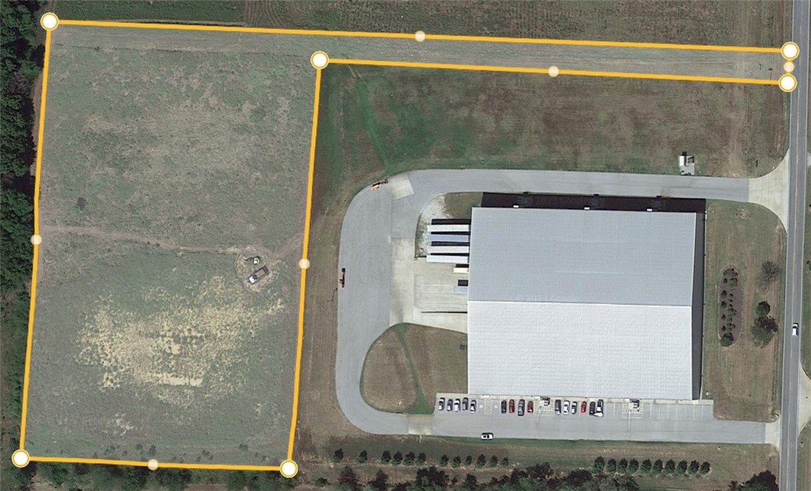 Flat lot with great development potential! Located in the Industrial Development area in Siloam Springs and just minutes away from the Hwy 412 and Hwy 16 intersection. Ideal land for office/warehouse, multiple storage units, or maintenance shop development.