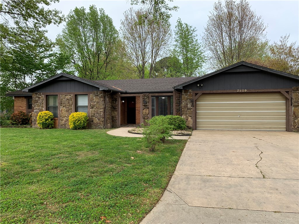 Fantastic location in established neighborhood! Very nice 2021 sq. ft all brick home with 3 bedrooms & 2 1/2 baths, new roof in 2019 & brand new dishwasher. Updated kitchen with Corian countertops and very nice cabinets with pull-out drawers. 2 living areas, one with a wood-burning fireplace. Master bedroom is large with walk-in closet and bath w/over-sized shower. Both of other bedrooms have built-in desks. Laundry room leads to the half bath, perfect location right off the garage. Must see before this is gone!