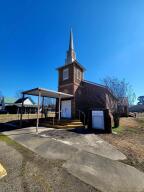 This church building is set up and ready for someone to have church in. Or what fun would it be to make it into a house, a resturant or some other small business Set your creative side free and make something unique. It offers a large open room, kitchen area and 1/2 bath. Building sits on a large corner lot.