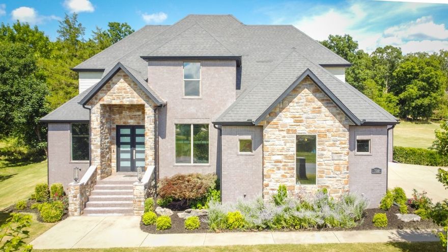 Discover luxurious living in the highly sought-after "The Knolls" subdivision of Fayetteville, Arkansas. This exquisite 4-bedroom, 3.5-bathroom home spans 3711 sq ft on a sprawling 2.068-acre lot. Enjoy sophisticated amenities including a library, formal dining area, and a media room for entertainment. Entertain effortlessly in the open floorplan with a custom island kitchen featuring built-ins and a convenient pot filler above the gas range and an unbelievable commercial fridge. Outside, relax on the covered patio with a wood-burning fireplace or unwind by the private 10x16 plunge pool. With a built-on deck and an attached 3-car garage, this home blends elegance with practicality, offering the ultimate in comfort and style. Listing back on market at no fault of the property.